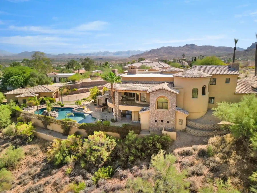 Hillside residence with a pool set into desert landscape